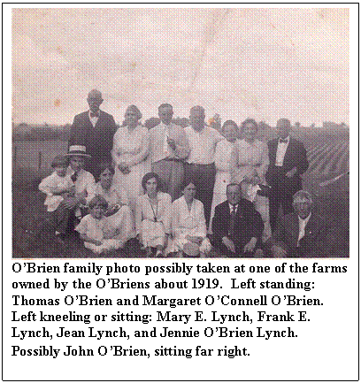 Text Box:  
OBrien family photo possibly taken at one of the farms owned by the OBriens about 1919.  Left standing: Thomas OBrien and Margaret OConnell OBrien.  Left kneeling or sitting: Mary E. Lynch, Frank E. Lynch, Jean Lynch, and Jennie OBrien Lynch.  Possibly John OBrien, sitting far right.
