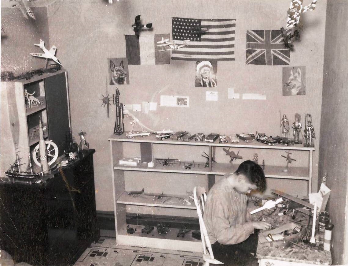 Me working on models in my room c1958.